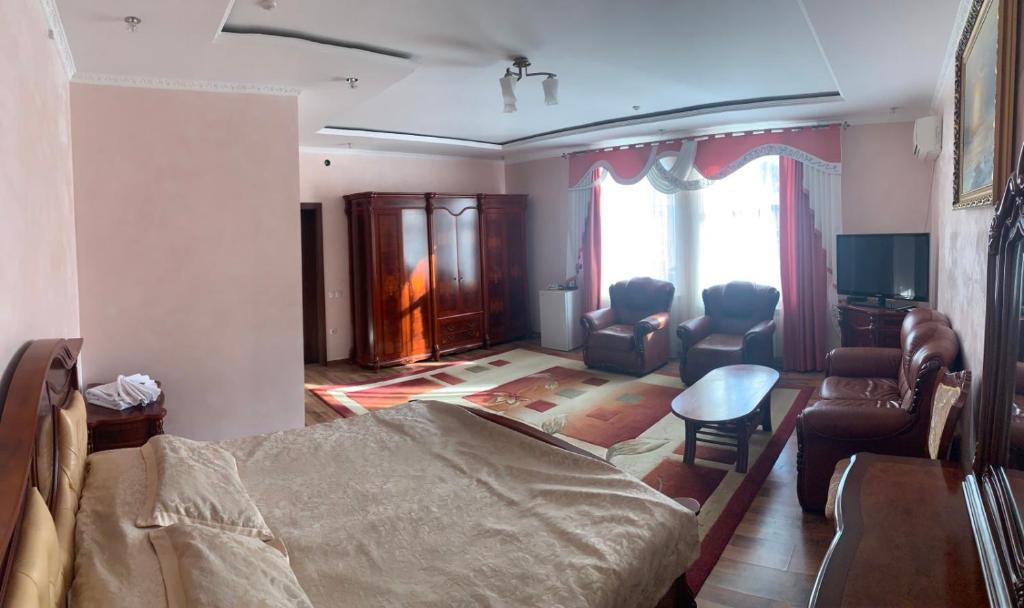 Postel nebo postele na pokoji v ubytování Richky Hotel