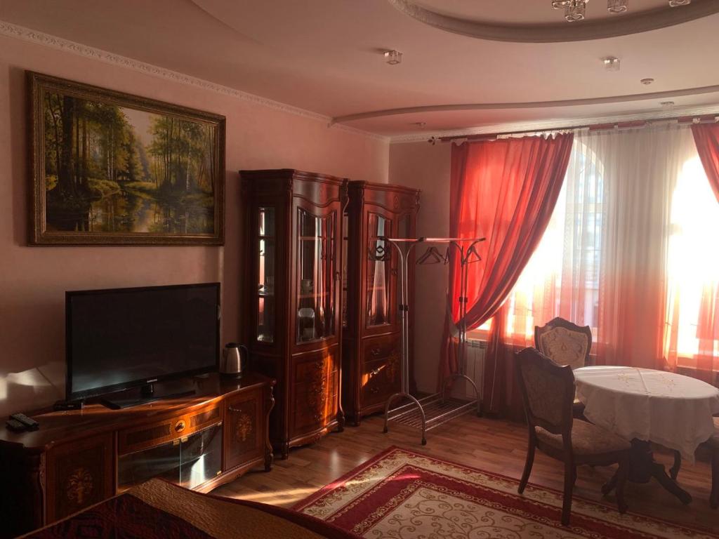 TV a/nebo společenská místnost v ubytování Richky Hotel