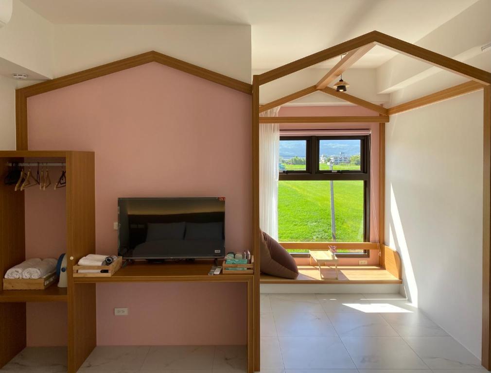 TV a/nebo společenská místnost v ubytování FUN Style Homestay