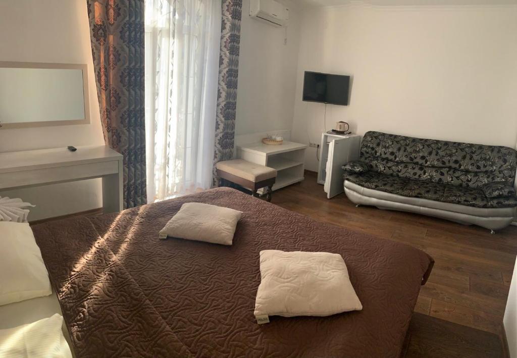 Postel nebo postele na pokoji v ubytování Richky Hotel