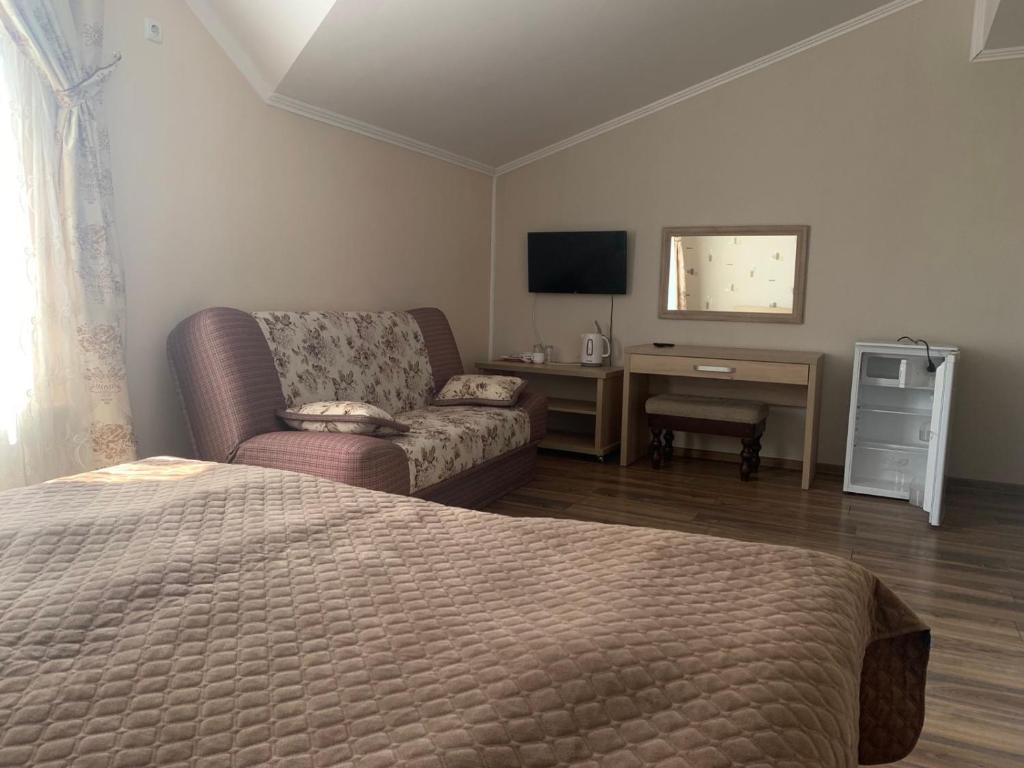 TV a/nebo společenská místnost v ubytování Richky Hotel