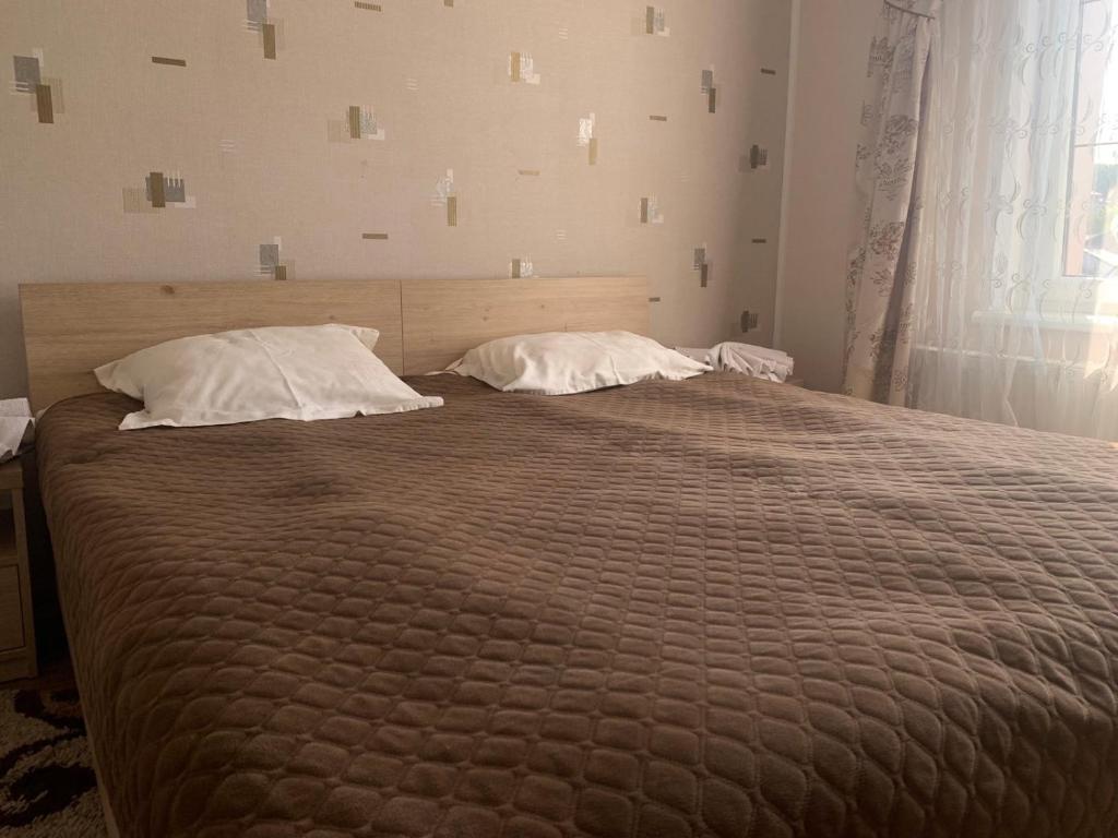 Postel nebo postele na pokoji v ubytování Richky Hotel