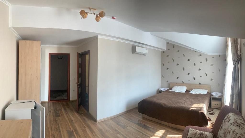 Postel nebo postele na pokoji v ubytování Richky Hotel