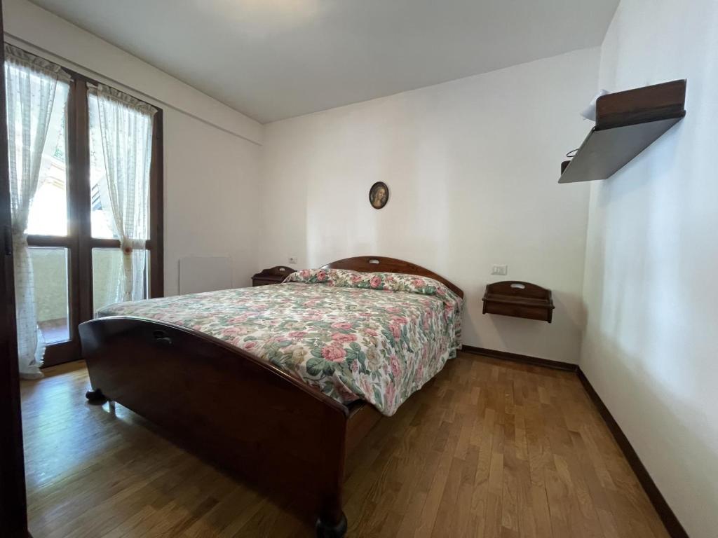 Posteľ alebo postele v izbe v ubytovaní 044 Trilocale, Pinzolo