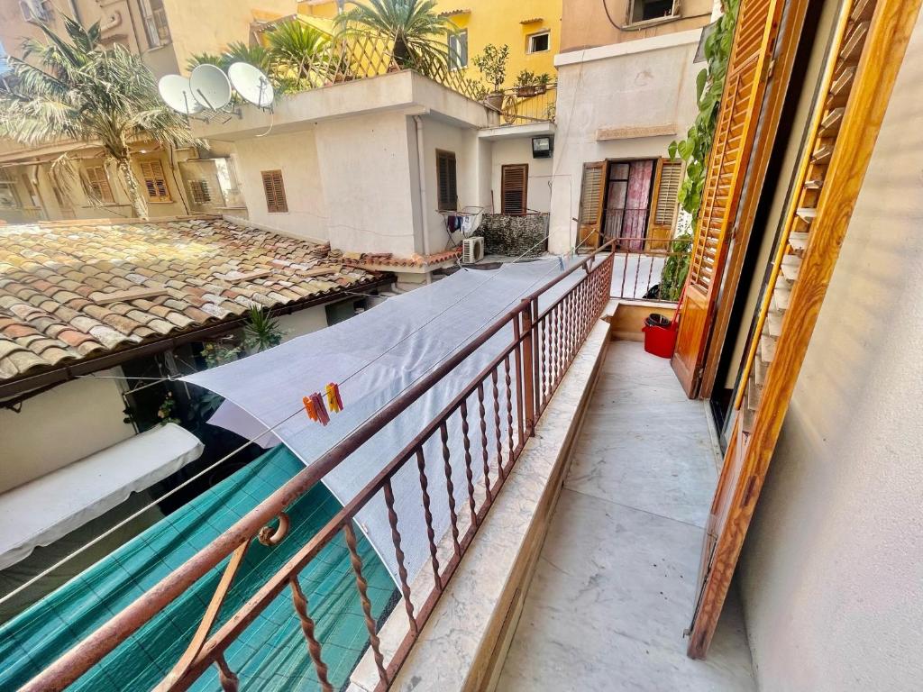 a balcony of a building with a swimming pool at A Casa di Mau in Palermo