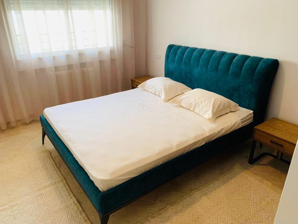 Postel nebo postele na pokoji v ubytování The Perfect Flat, Lac 2, Tunis