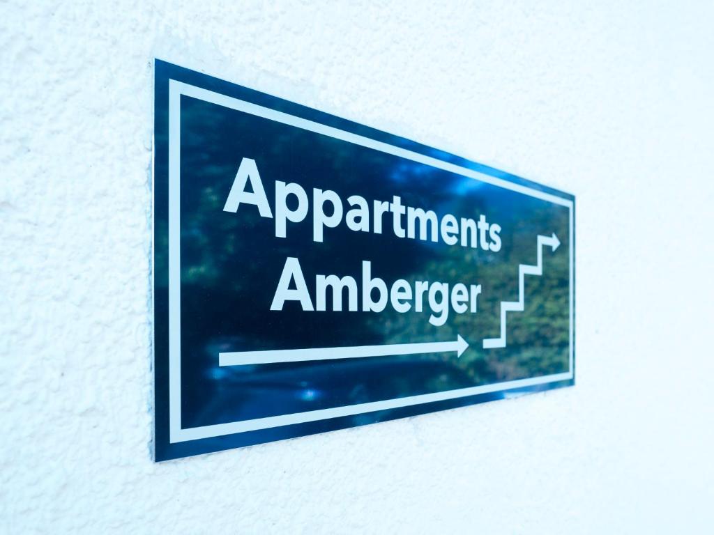 a sign on a wall with the words applicants istg at Haus Amberger in Bayerisch Gmain