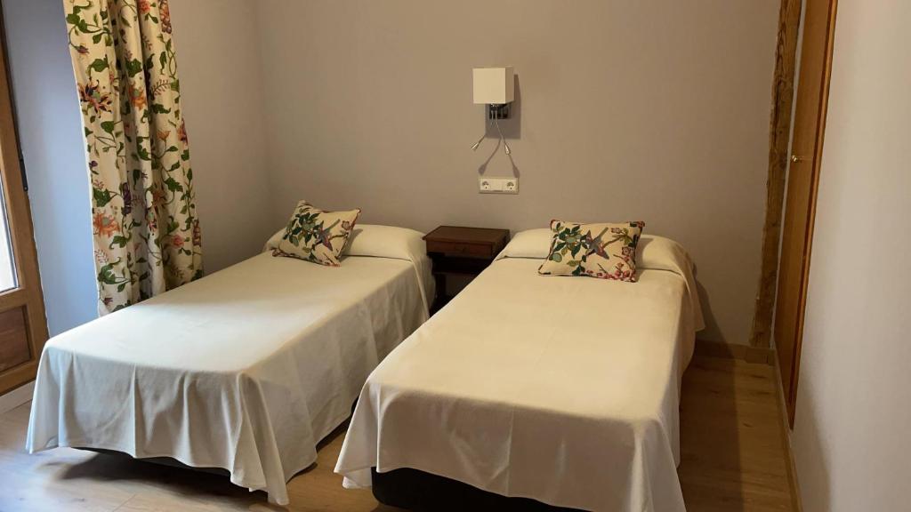 Postel nebo postele na pokoji v ubytování Hotel-Hospedería los Templarios