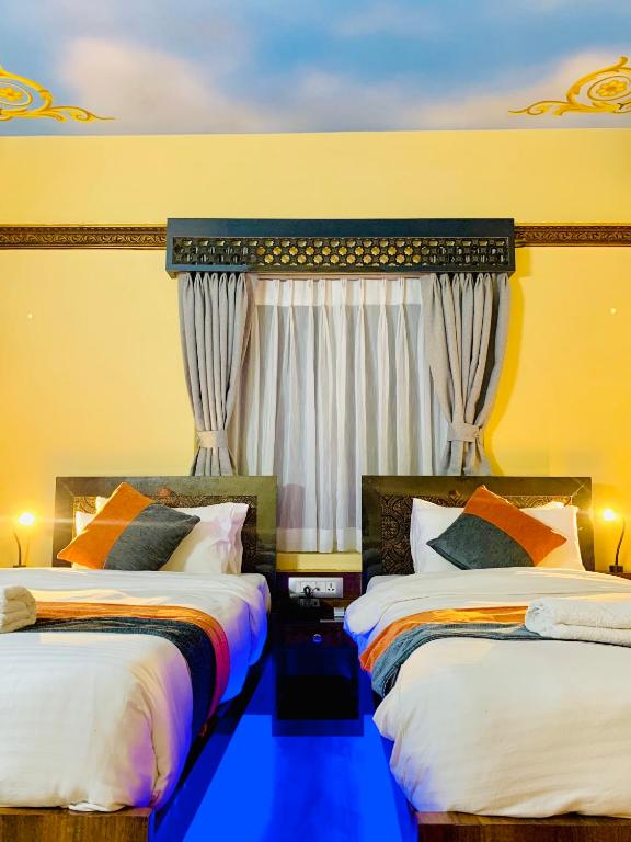 Postel nebo postele na pokoji v ubytování Hotel ABC, Boutique Hotel in Pokhara