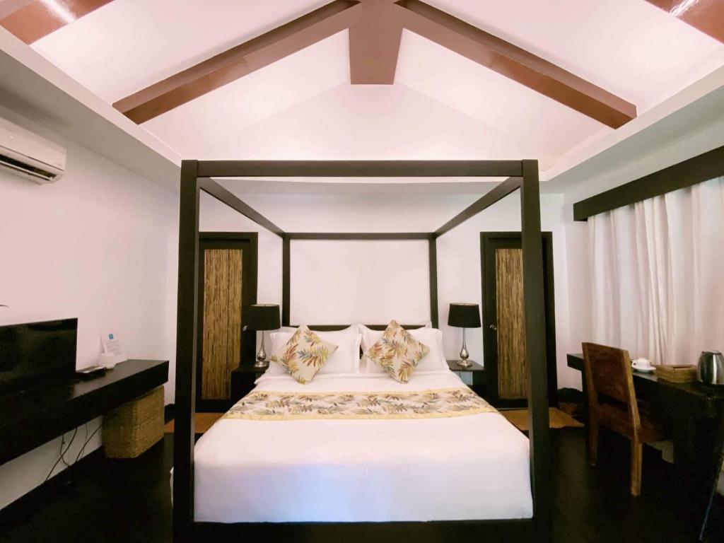 Postel nebo postele na pokoji v ubytování Lio Villas Resort