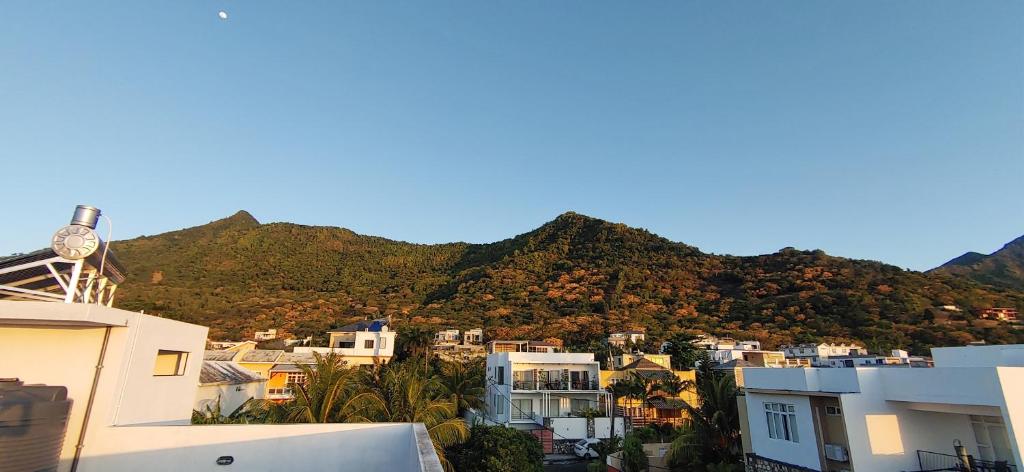 a view of a city with mountains in the background at Labrize Studio in La Gaulette