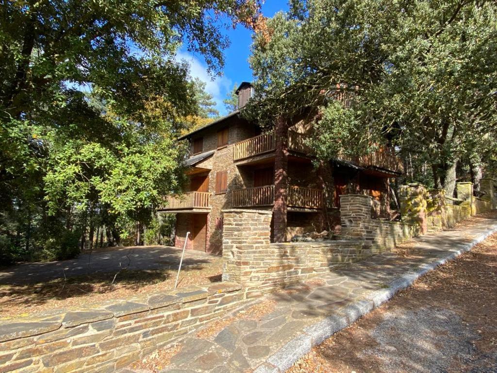 a brick house with a balcony on the side of it at Prades Cal Rueda in Prades