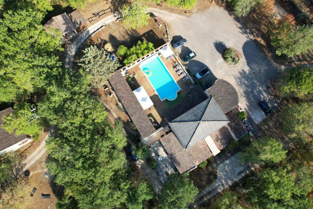 an overhead view of a house with a swimming pool at le clos des dryades f in Vers