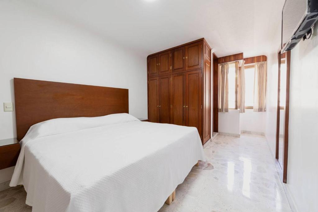 Postel nebo postele na pokoji v ubytování Violeta Hotel Boutique