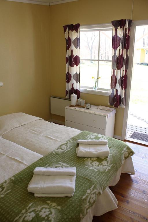 Postel nebo postele na pokoji v ubytování Gula Hönan Guest House