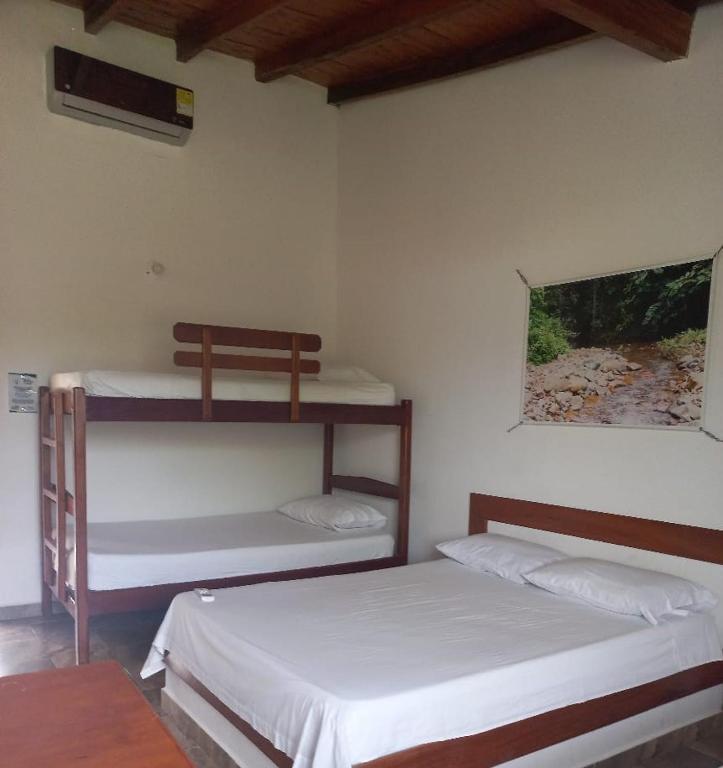 Postel nebo postele na pokoji v ubytování Hotel Mares Capurganá