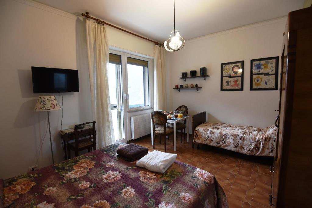 A bed or beds in a room at B&B Tou Lì