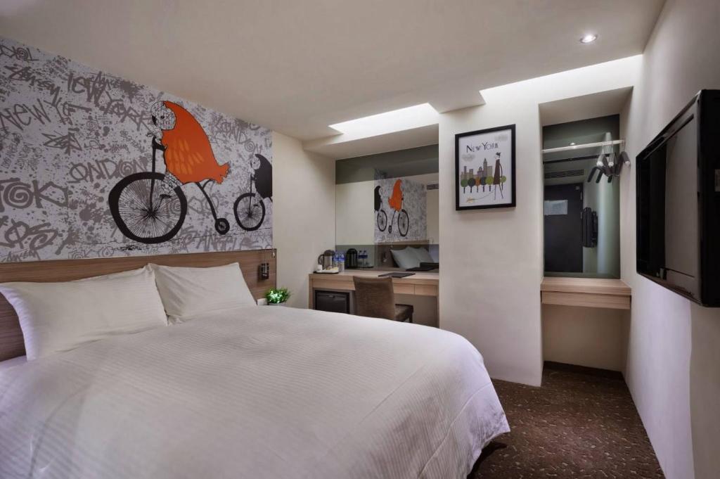 Katil atau katil-katil dalam bilik di Hotels Here - Taipei