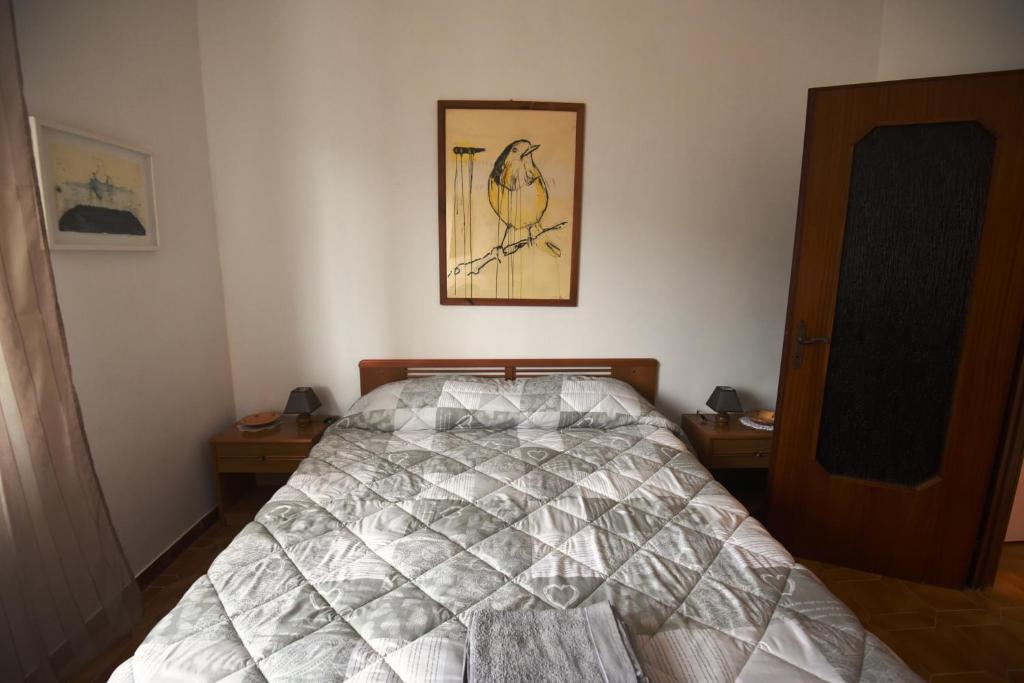 A bed or beds in a room at B&B Tou Lì