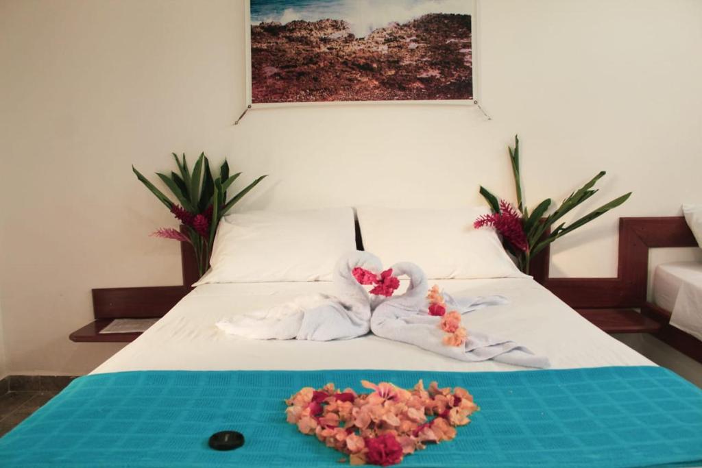 Postel nebo postele na pokoji v ubytování Hotel Mares Capurganá