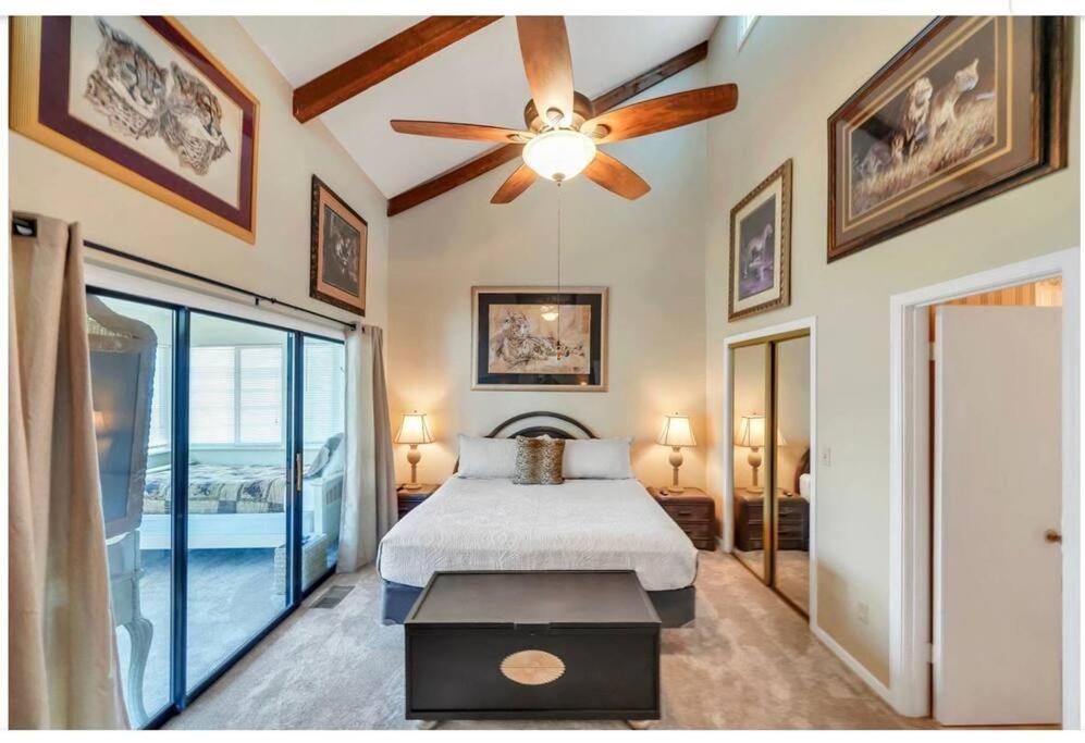 a bedroom with a bed and a ceiling fan at New listing!!! 4 min walk to the beach! in Destin