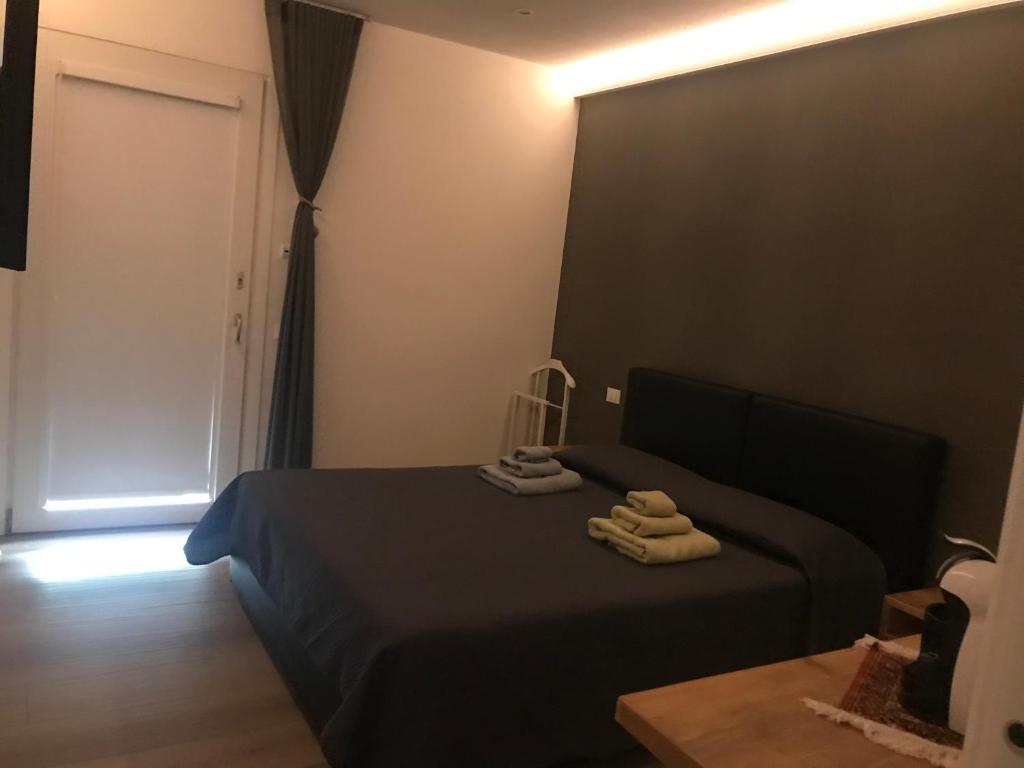 Łóżko lub łóżka w pokoju w obiekcie Dimora Aurora