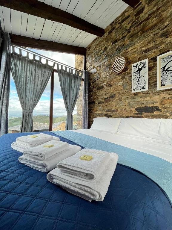 Postel nebo postele na pokoji v ubytování Complejo Rural Lar de Vies
