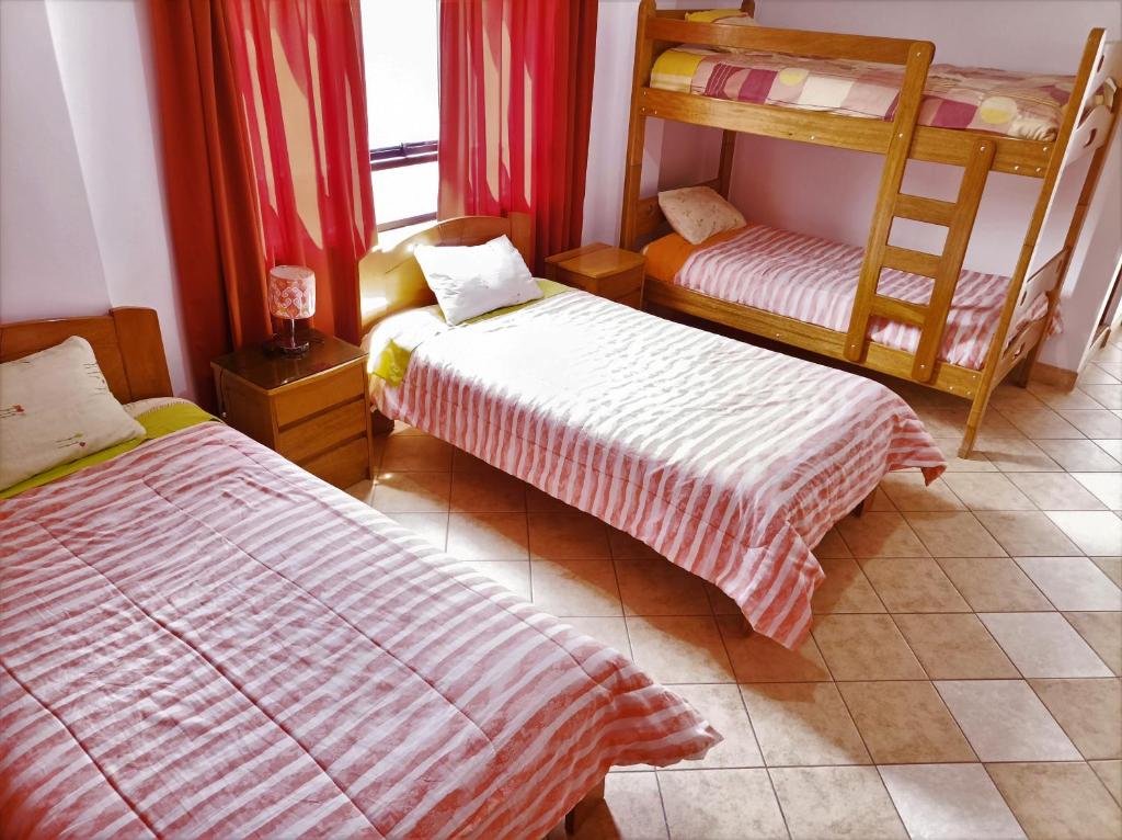 Postel nebo postele na pokoji v ubytování Kantu Hospedaje