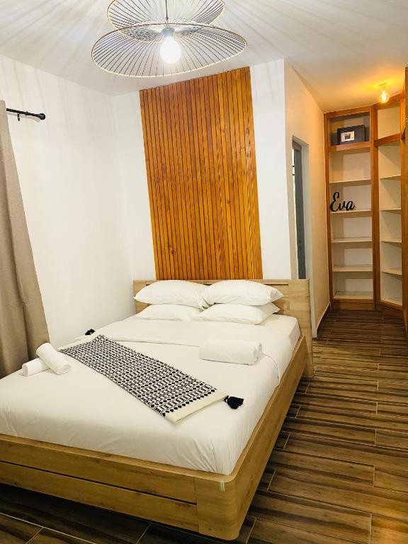 Postel nebo postele na pokoji v ubytování Moya Résidence by MD