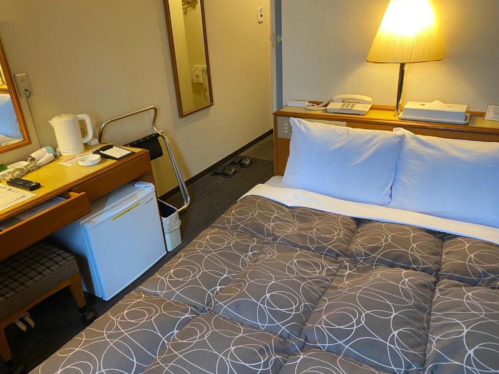 Postel nebo postele na pokoji v ubytování Az Inn Fukui (Ace Inn Fukui)