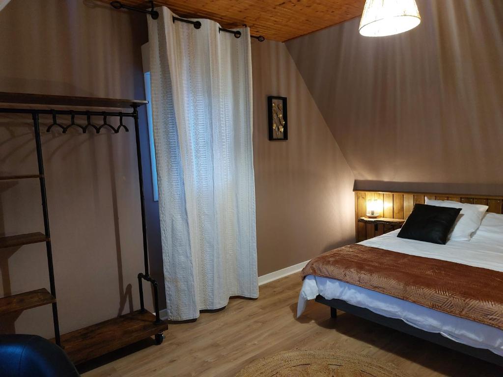 Postel nebo postele na pokoji v ubytování L'escale d'Armor