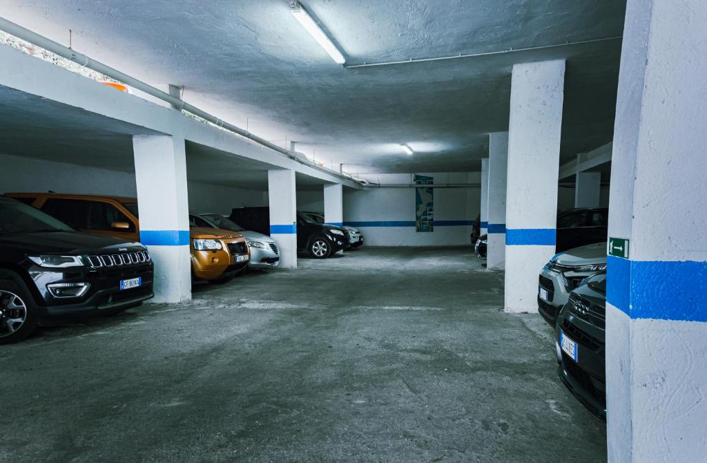 an empty parking garage with cars parked in it at Residence Porto Ulisse in Parghelia