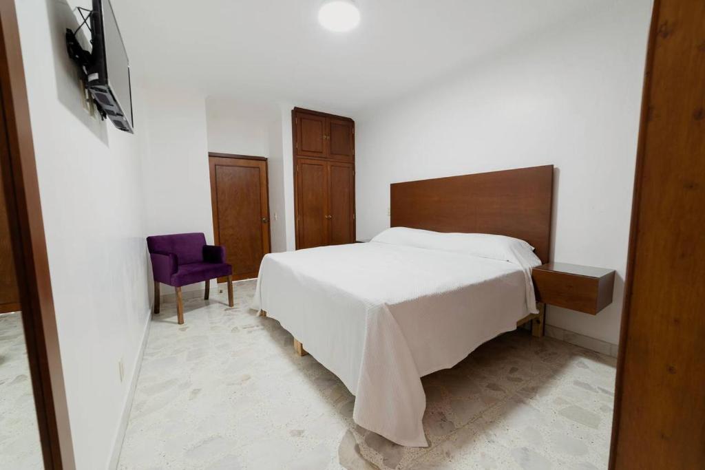 Postel nebo postele na pokoji v ubytování Violeta Hotel Boutique