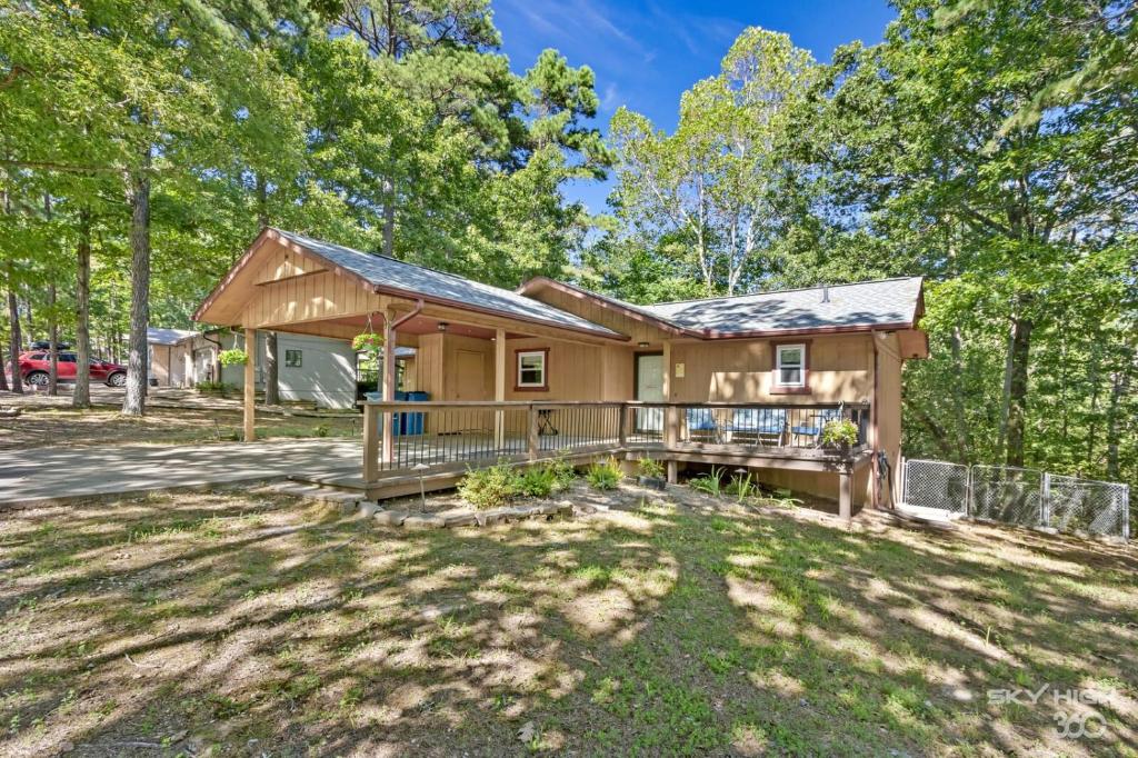 a home in the woods with a large yard at Wooded, Quiet Cottage, Very close to the Back 40 in Bella Vista