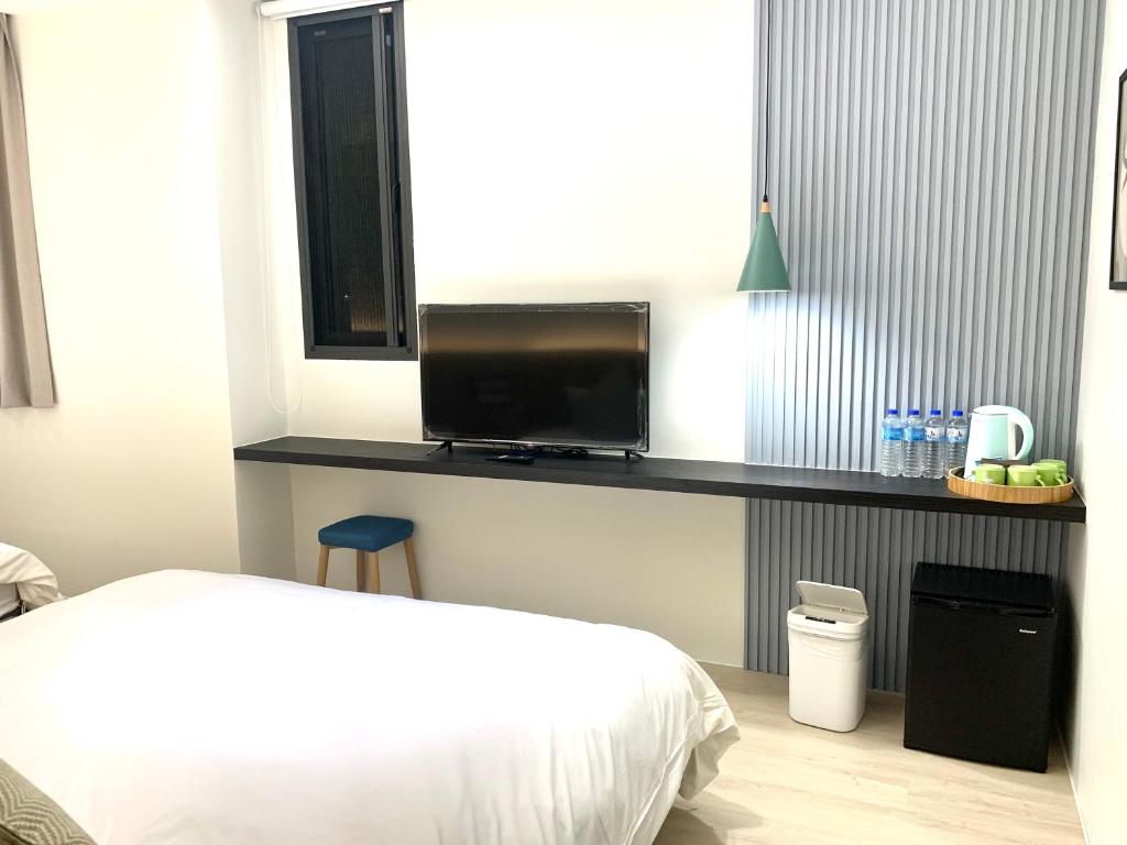 Postel nebo postele na pokoji v ubytování Jabez Homestay