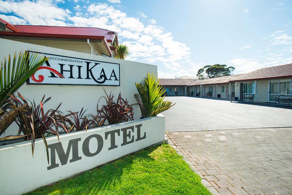 a motel sign on the side of a building at AhiKaa Gisborne Motel in Gisborne