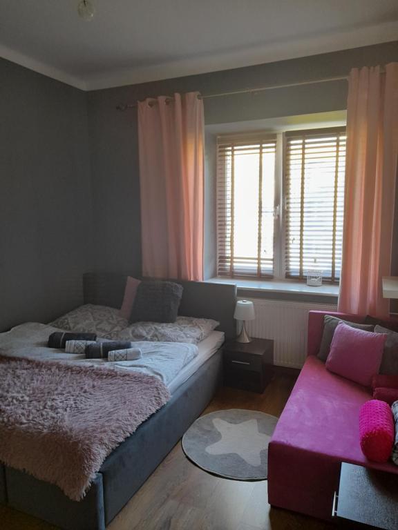 Posteľ alebo postele v izbe v ubytovaní Apartament Mieszkanie w Helu