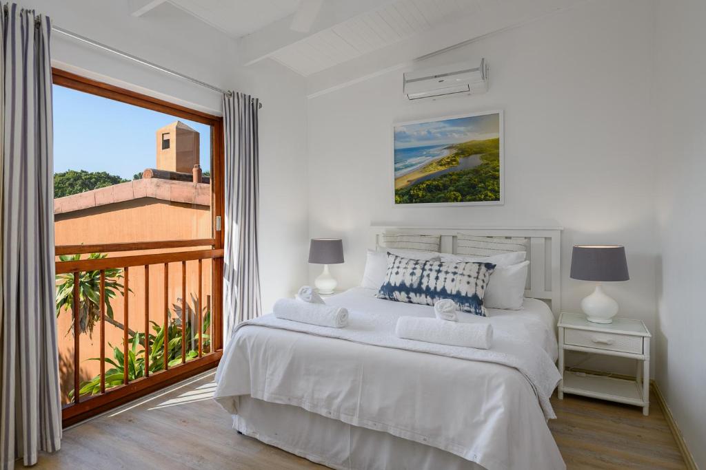 Giường trong phòng chung tại San Lameer Villa 2610 - 4 Bedroom Classic - 8 pax - San Lameer Rental Agency