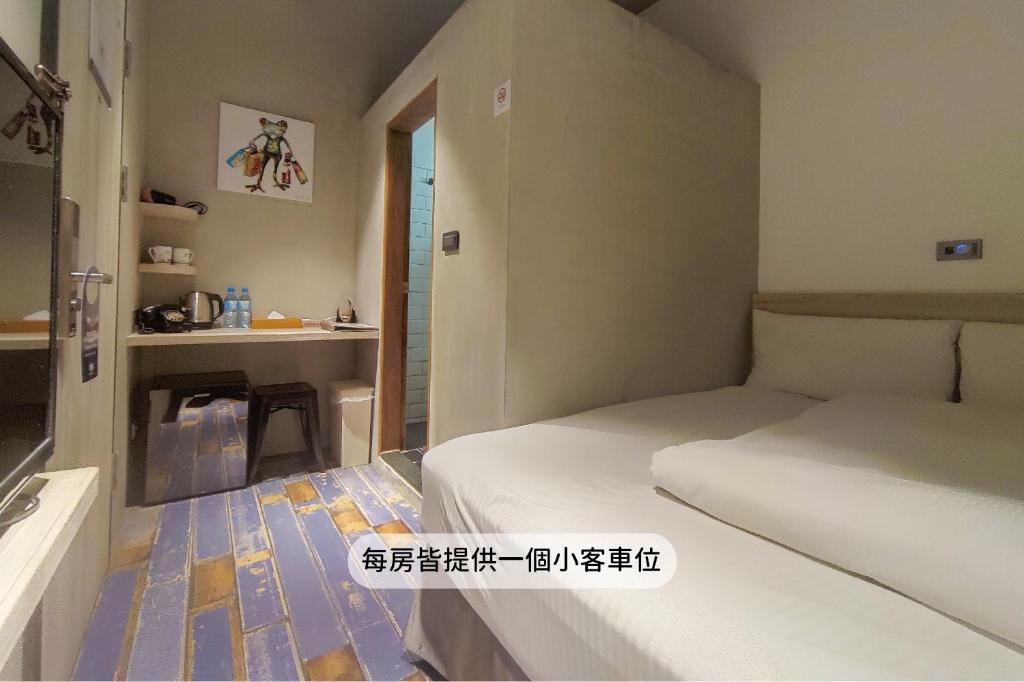 MINI HOTELS(逢甲館)客房内的一张或多张床位