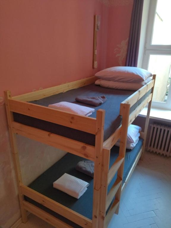 Posteľ alebo postele v izbe v ubytovaní Oliwka Hostel