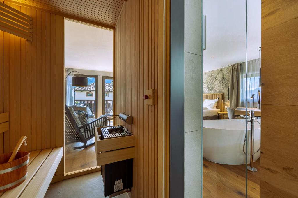 Postel nebo postele na pokoji v ubytování Hotel Ansitz Rungghof