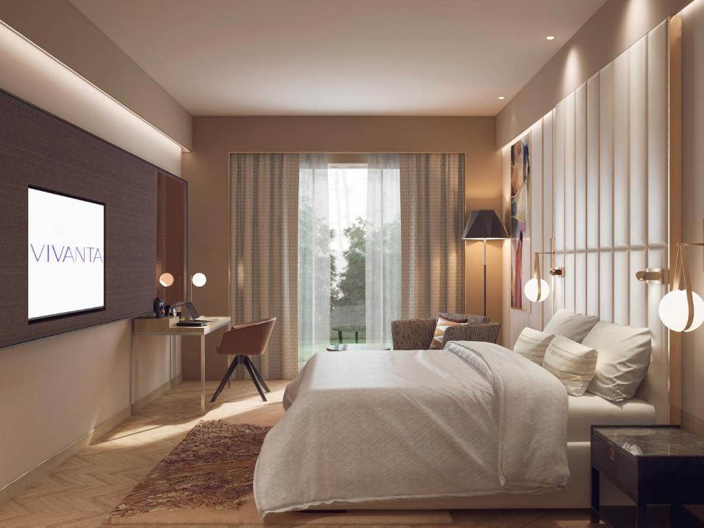 Postel nebo postele na pokoji v ubytování Vivanta Vijayawada, MG Road