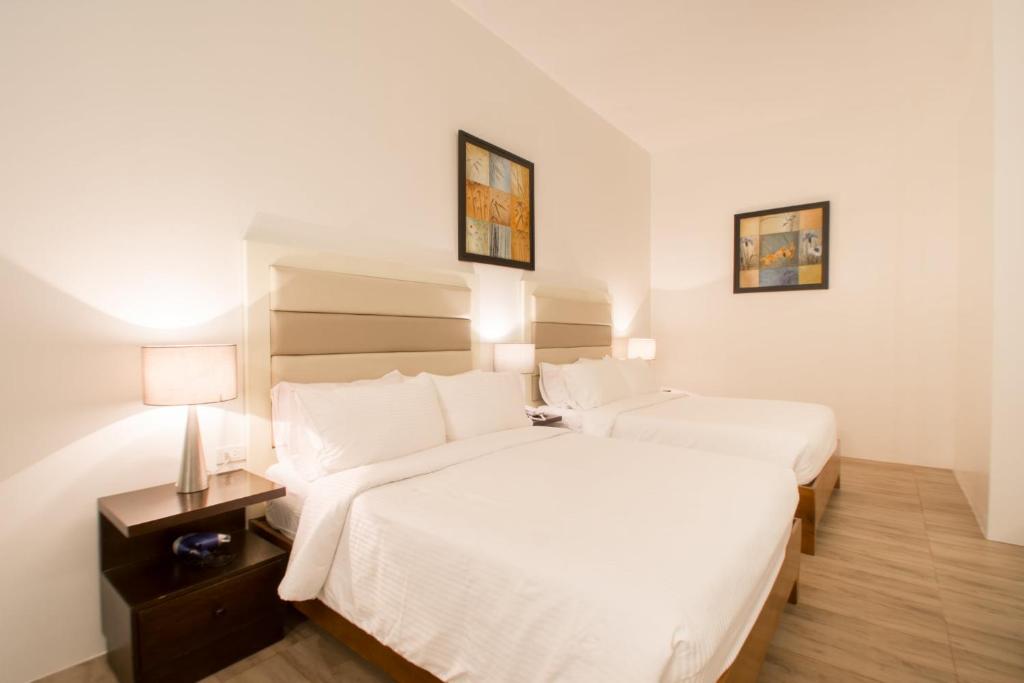Postel nebo postele na pokoji v ubytování MARZON HOTEL KALIBO