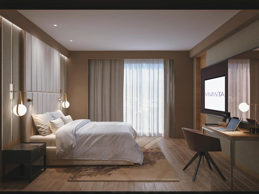 Postel nebo postele na pokoji v ubytování Vivanta Vijayawada, MG Road