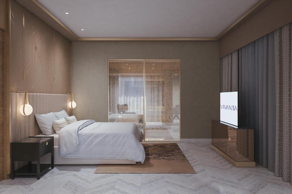 Postel nebo postele na pokoji v ubytování Vivanta Vijayawada, MG Road