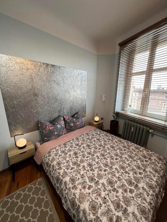 Postel nebo postele na pokoji v ubytování Jedności Hostel