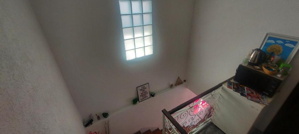 Giường trong phòng chung tại Pandora's Place