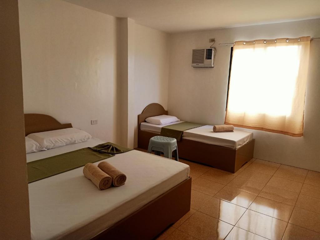 Postel nebo postele na pokoji v ubytování Alona Guest House