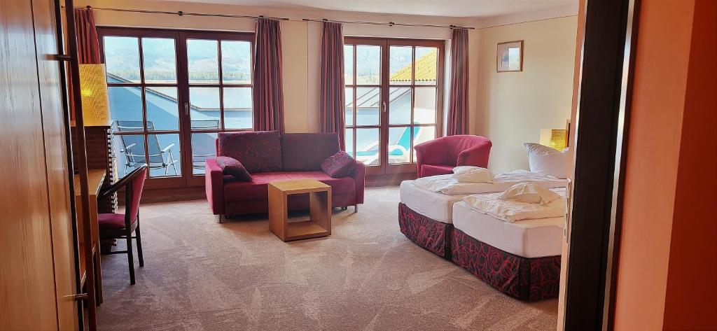 Postel nebo postele na pokoji v ubytování Hotel Geiger