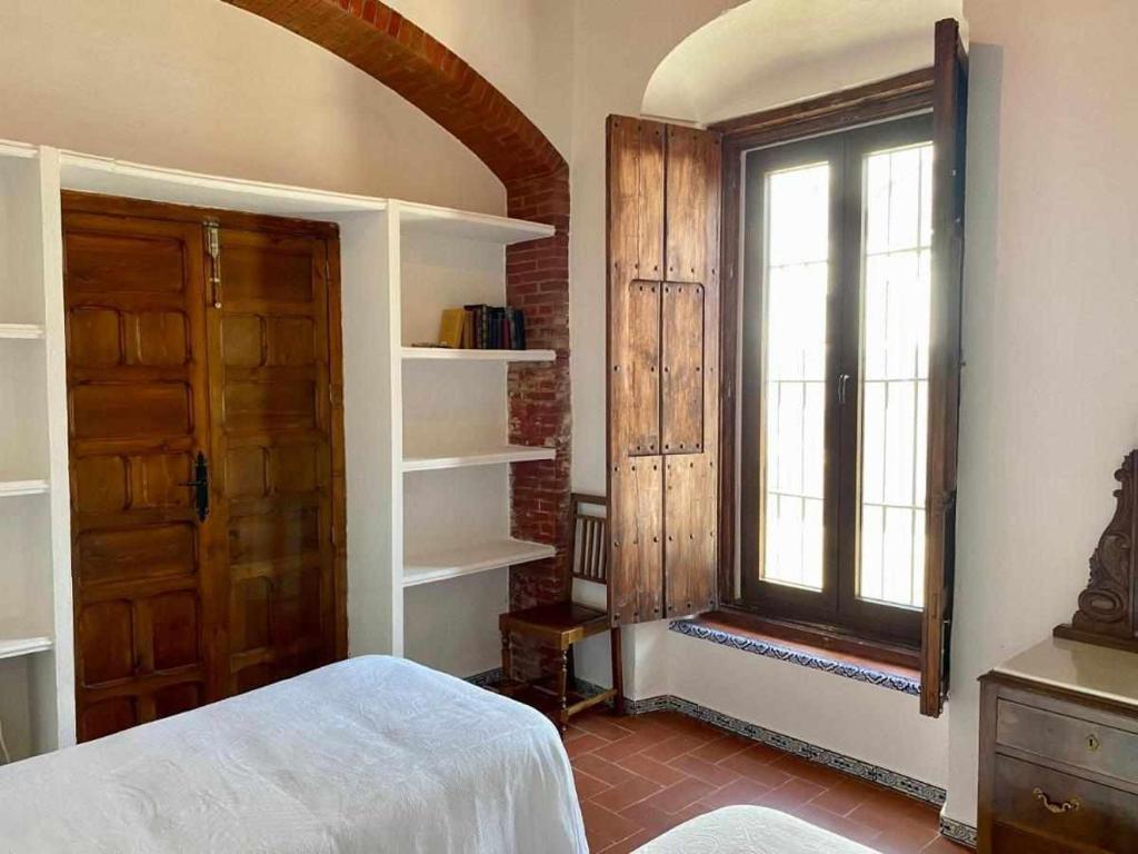 Łóżko lub łóżka w pokoju w obiekcie La Casona de la Sierra